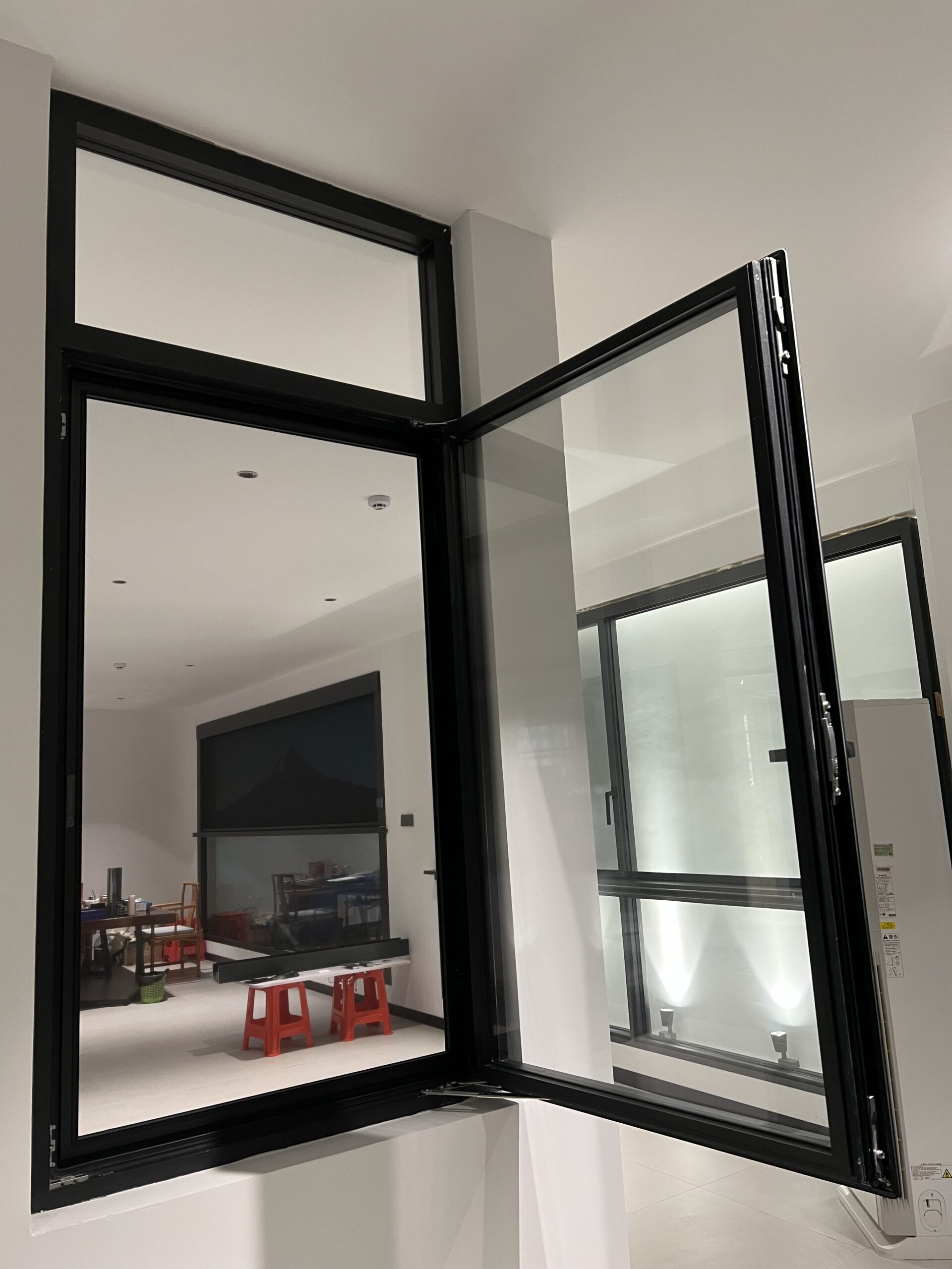 Opening window sash and insect screen in a showroom
