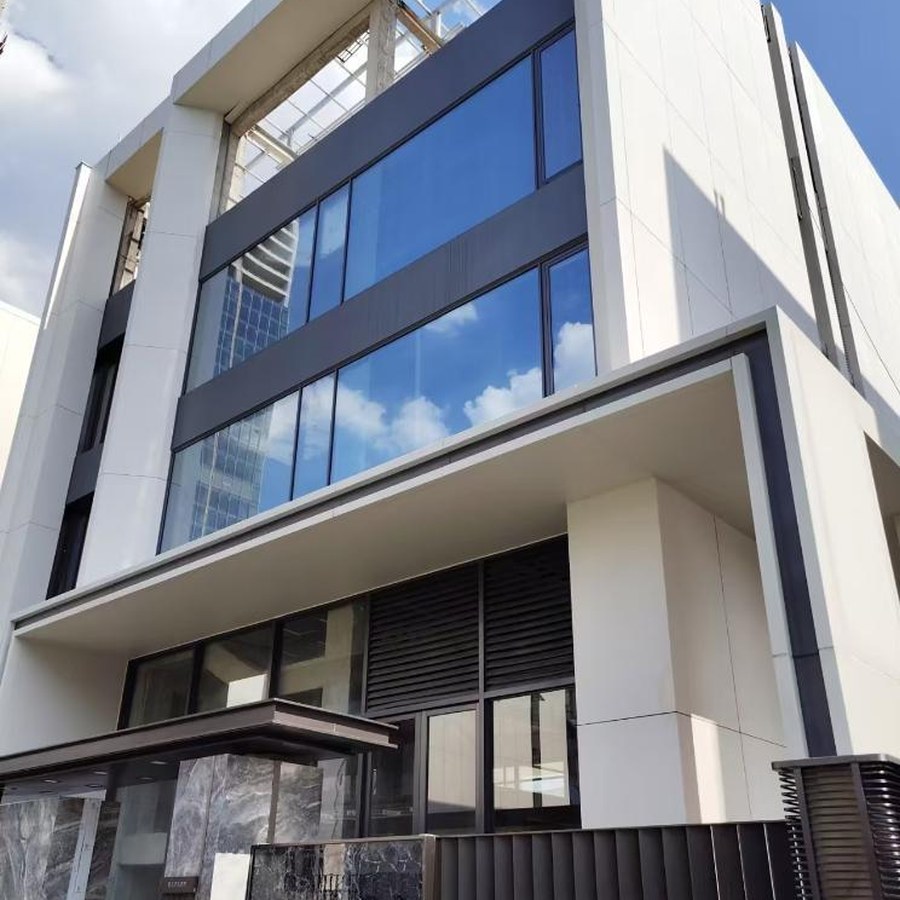 Building facade shown alongside the rock panel curtain wall system