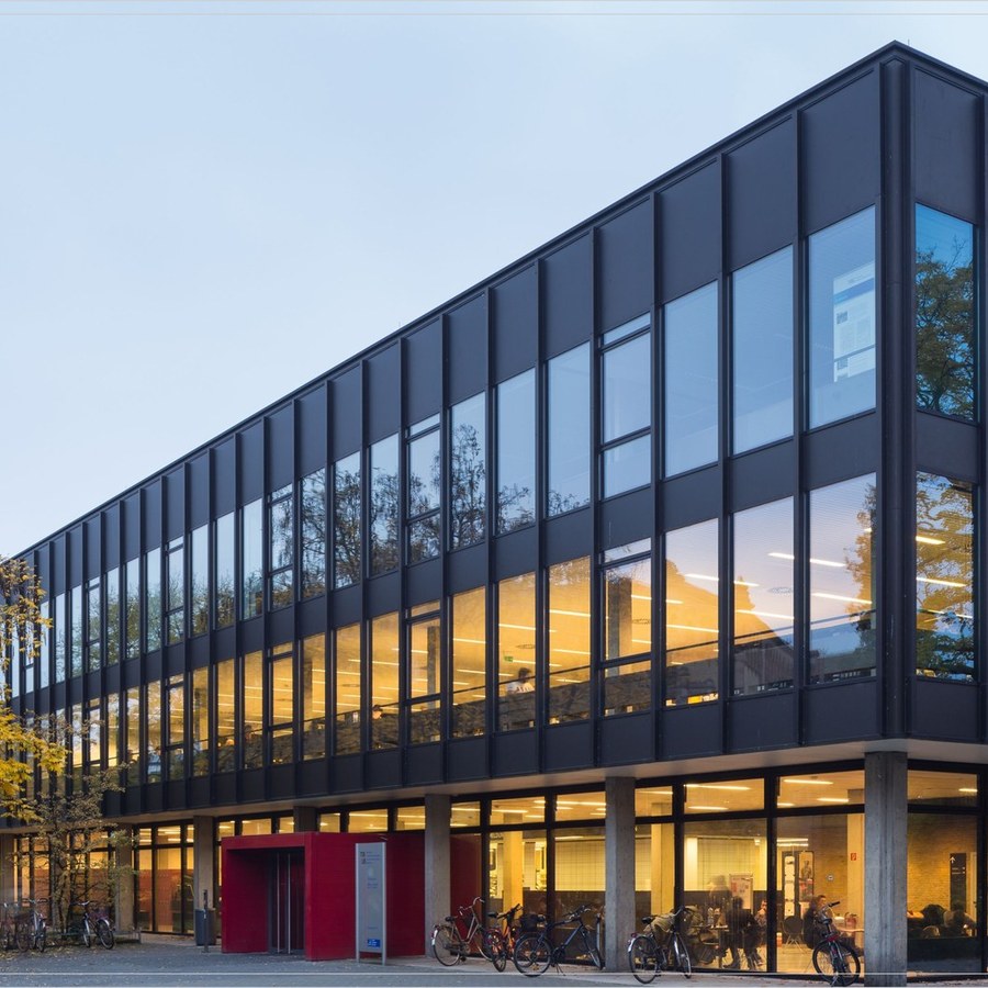 Glazed building facade with slim aluminium framing